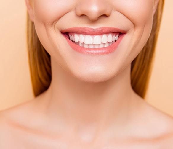 Closeup of woman smiling with white, straight teeth